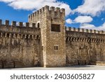 Old medieval stone fortress walls of the city with battlements and a tower. Vitoria-Gasteiz, Basque Country, Álava, northern Spain.