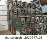 Old Metal Ammunition Storage Boxes (US) Stacked and Ready for Sale