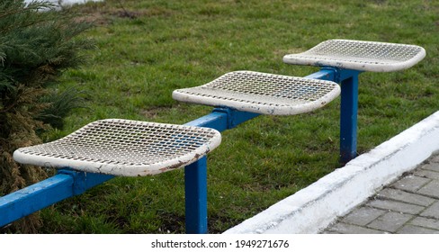 Old Metal Bench In A City Park. Landscaping, Urban Planning, Public Spaces.