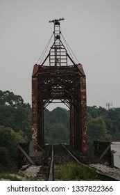 An Old Metal Bridge Over Railroad Tracks