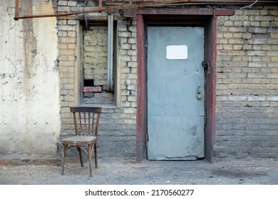 Old Metal Door In A Brick Building