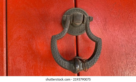 Old Metal Door Knob On Red Wooden Door