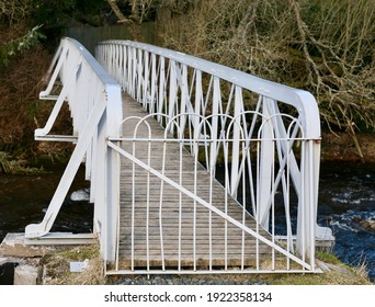 An Old Metal Footbridge Over The River