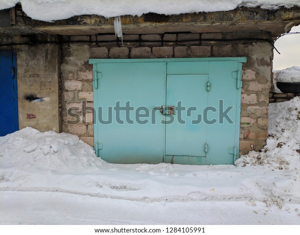 old metal garage doors in\
winter