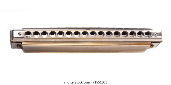 Old metal harmonica isolated on white background