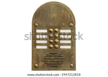 Old metal intercom cut out on white background. Isolated vintage object. Close shot.