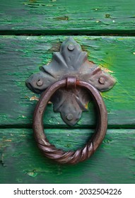  An Old Metal Knocker On A Green Vintage Door, Close Up