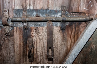 Old Metal Latch On A Wooden Door