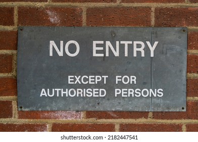 Old metal No Entry sign on a brick wall - Shutterstock ID 2182447541