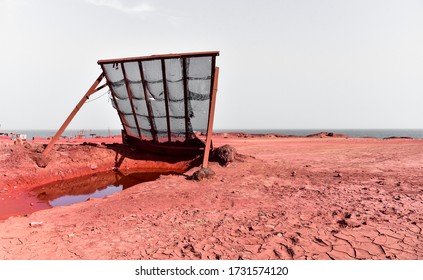 Old metal sand and clay sieve on Persian Hormuz Island's famous Red Beach, Iran. Seaview.