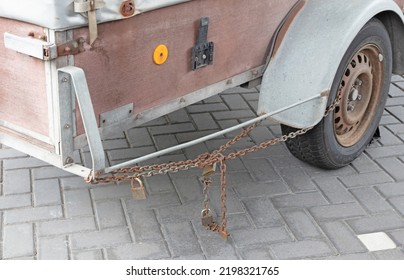 Old Metal Trailer With Rusty Chain, Many Locks