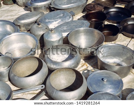 Similar – many part colorful tin buckets at the flea market