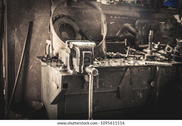 Old metal vise in the metalwork shop.\
Technology, old school, handmade in the\
workshop