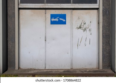 Old Metal Warehouse Door, Hangar With Tow Away Sign