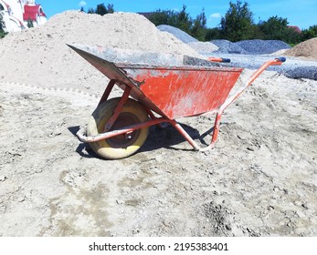 Old Dirty Garden Metal Wheelbarrow Cart, Used Gardening Tool Equipment Side View. Agriculture Cart Wheel Farm, Flat Lawn Ground Supplies, Garden Trolley, Handcart With Wheel