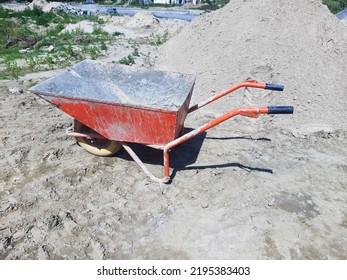 Old Dirty Garden Metal Wheelbarrow Cart, Used Gardening Tool Equipment Side View. Agriculture Cart Wheel Farm, Flat Lawn Ground Supplies, Garden Trolley, Handcart With Wheel