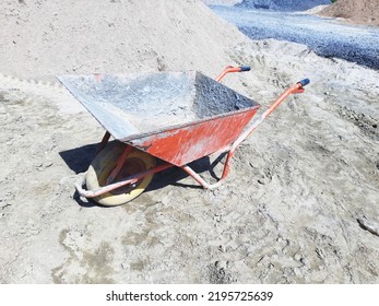 Old Dirty Garden Metal Wheelbarrow Cart, Used Gardening Tool Equipment Side View. Agriculture Cart Wheel Farm, Flat Lawn Ground Supplies, Garden Trolley, Handcart With Wheel