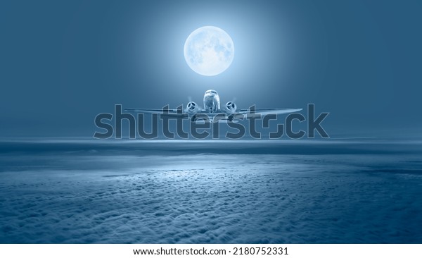 Old metallic propeller\
airplane in the sky with full moon \