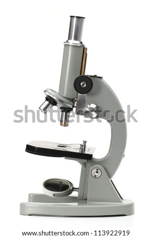 old microscope isolated on white background
