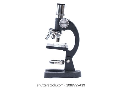 an old microscope on white background