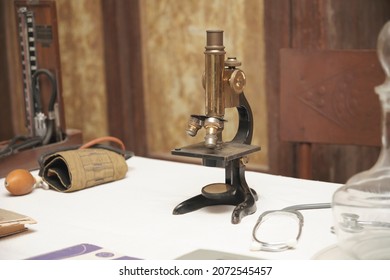 The old microscope was used at the doctor's workplace many years ago.