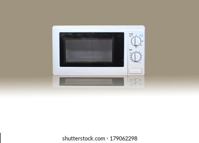 Old Microwave Oven On Gray And White Background