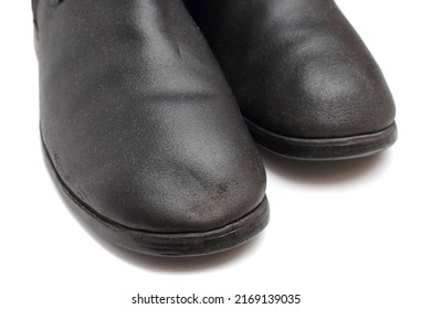 Old military boots made of leather on white background, black army boots isolated on white, combat and ceremonial shoes of a soldier of the army of the Soviet Union
