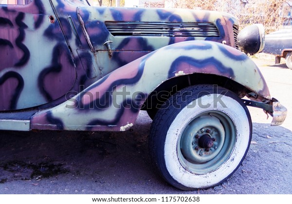 Old military car of color camouflage of\
times of World War II. Military car of\
khaki.