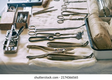 An Old Military Field Hospital With Retro Tents And Vintage Medical Beds From The First World War. Mobile Clinic For The Treatment Of Soldiers Of The Early Twentieth Century