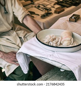 An Old Military Field Hospital With Retro Tents And Vintage Medical Beds From The First World War. Mobile Clinic For The Treatment Of Soldiers Of The Early Twentieth Century