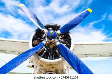 Old Military Plane Propeller Closeup. Vintage Fighter Plane Close Up By Blue Sky Background