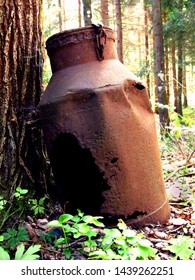 Old Milk Pitcher In The Forest