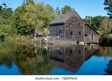 Old Mill By A Pond And Dam