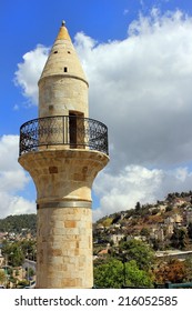 Old Minaret In Safed On The Background Of A Residential Area On Mount Canaan, Israel