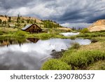 Old mining shack in the Colorado mountains with storm moving in near Leadville, Colorado