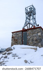 Old Mining Structure in Snowy Winter Landscape at Historic Site