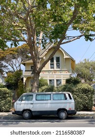 Old Minivan Parked In Front Of The House