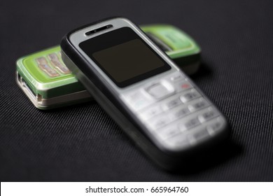 old mobile phone on black background