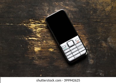 Old Mobile Phone  Still Life On The Wood Table