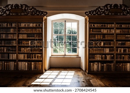 An old monastery library with a window where light streams in