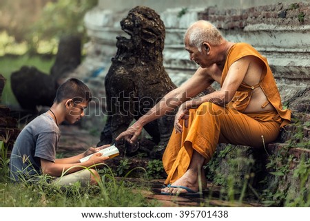 Old monk teaches boy 