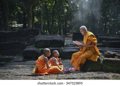 Old Monk are teaching little monks of buddhist and spiritual of religion buddha on the laterite in the forest
