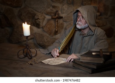 Old Monk Writes Letters In A Medieval Monastery 