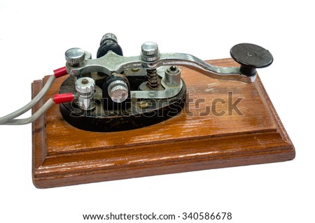 old morse key telegraph on wood table
