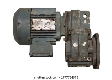 Old motor laid on the floor. The old motor is scrapped. Motor isolated on white background.  clipping path. Old electric motor