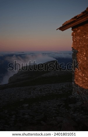 An old mountain cabin with sunrise bliss. Nature's beauty captured. Perfect for inspiring projects.