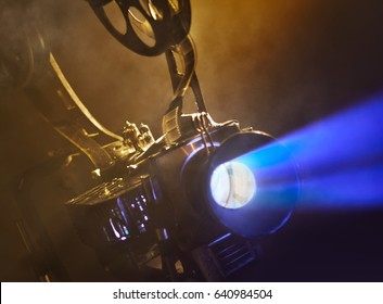 Old Movie Projector With The Film On The Brick Wall Background