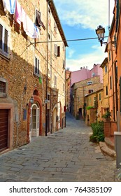 Old Narrow Alley In The Medieval Village Of Castagneto Carducci In Tuscany Italy, Birthplace Of Poet Giosuè Carducci