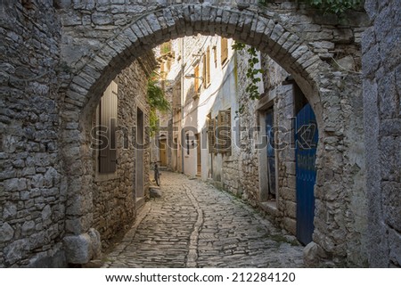Old and narrow street, paved of cobble stones, in Bale town, Ist
