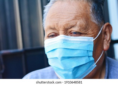 Old Native American Man Wearing Mask.